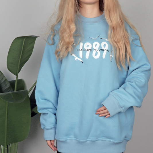 1989 Sweatshirt Taylors Version - Blue embroidered eras knit crewneck front view