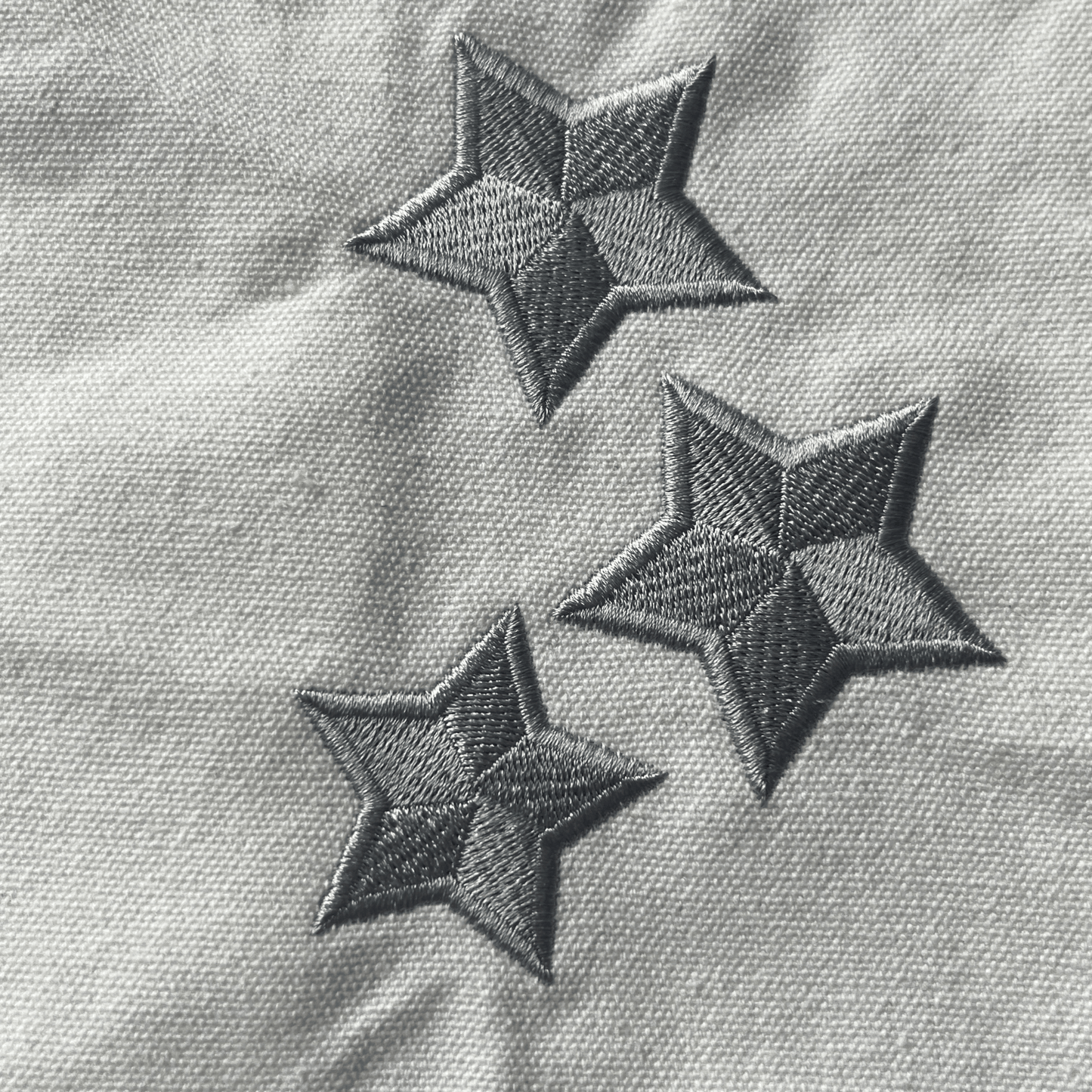 Taylor Swift Tote Bag, Folklore Tote Bag with three embroidered stars on a textured fabric background - Shoptown Boutique