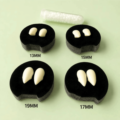 Four black circular foam pieces showing different tooth-size options labeled 13MM, 15MM, 17MM, and 19MM, with a clear tube of small white teeth above on a pale green background.