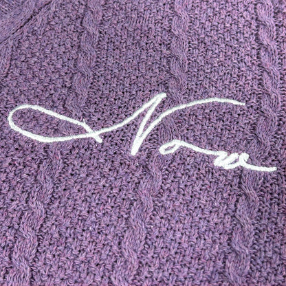 Purple crop cardigan flat lay showing full front embroidery and structure