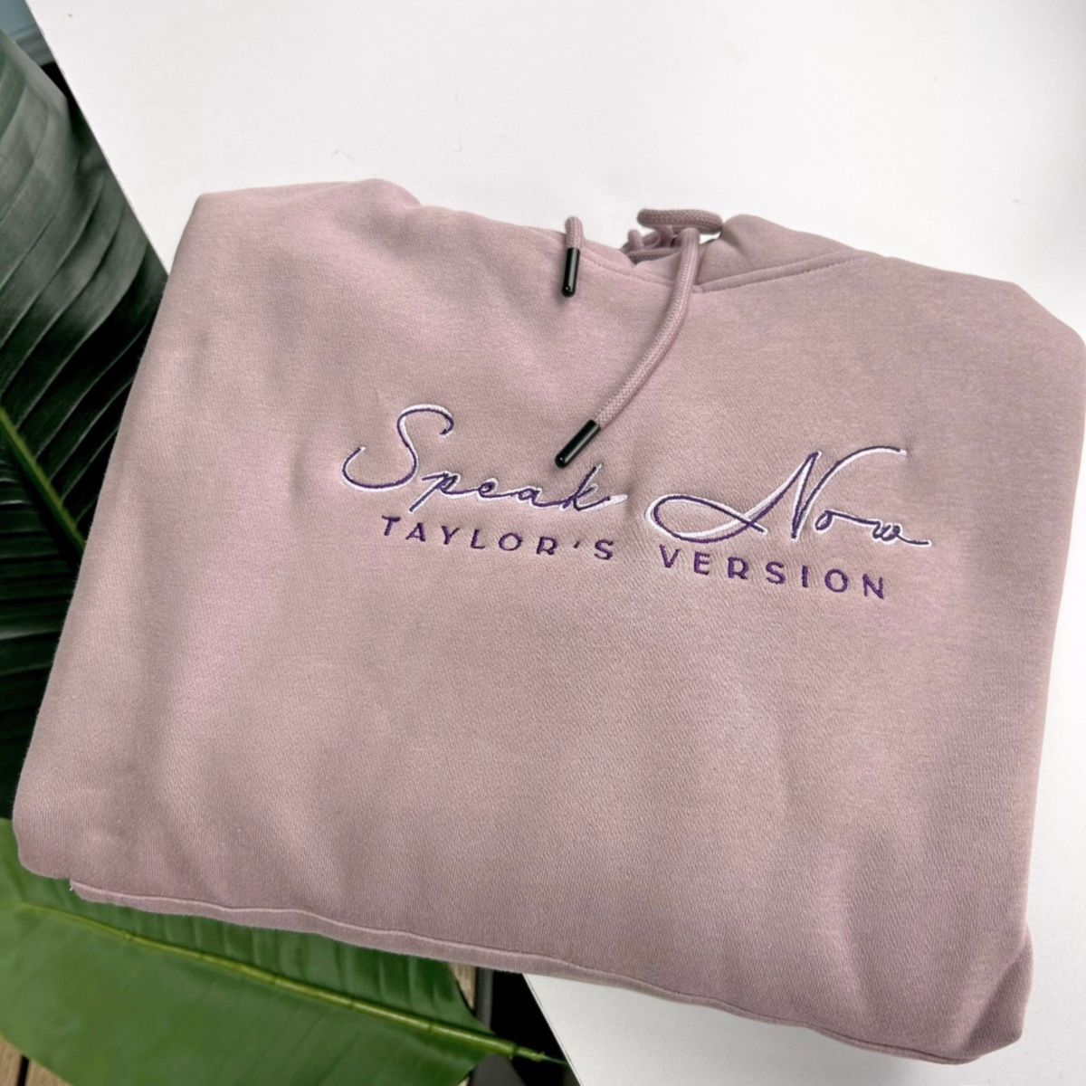 Taylors Version Speak Now Hoodie - Purple eras knit hoodie folded showing embroidery