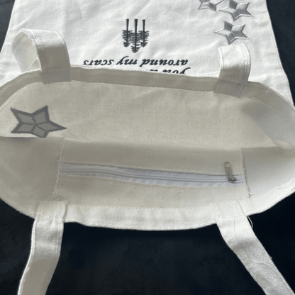 Taylor Swift Folklore Tote Bag with black text and star designs on a dark background -  Shoptown Boutique
