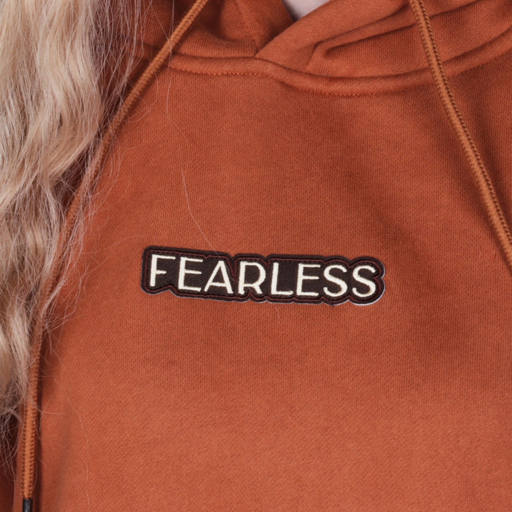 Taylors Fearless Hoodie - Close up of orange embroidered eras album detail