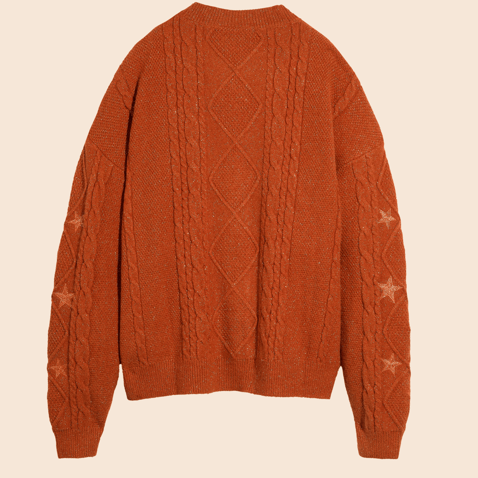 Brown cable knit sweater on a beige background