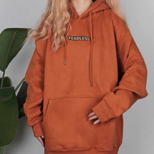 Taylors Fearless Hoodie - Orange embroidered eras knit hoodie front view